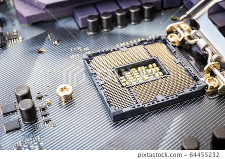 Closeup detail of CPU socket of a modern computer black motherboard. Electronic small component details. Select focus 64455232