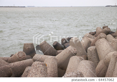 Tetrapods along the waterfront sea wall Tetrapods along the waterfront sea wall 64457062