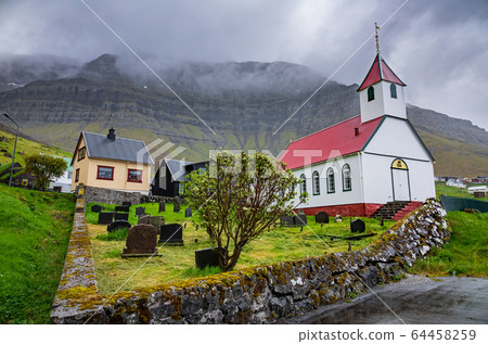 Very small village with church in Faroe Islands Very small village with church in Faroe Islands 64458259