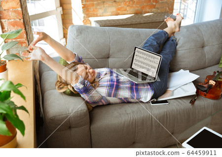 Young woman studying at home during online courses or free information by herself 64459911