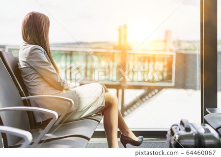 Portrait of young attractive businesswoman sitting Portrait of young attractive businesswoman sitting 64460067