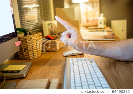 close-up of a man warning or wait a moment  64460225