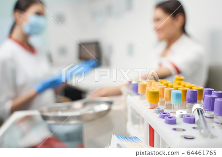 Focused photo on test tubes that being in plastic support 64461765