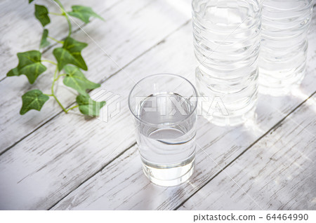 Cup of water and plastic bottle 64464990