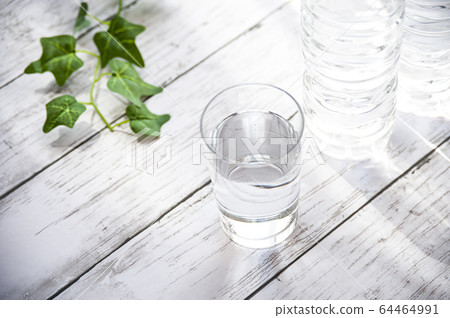Cup of water and plastic bottle 64464991
