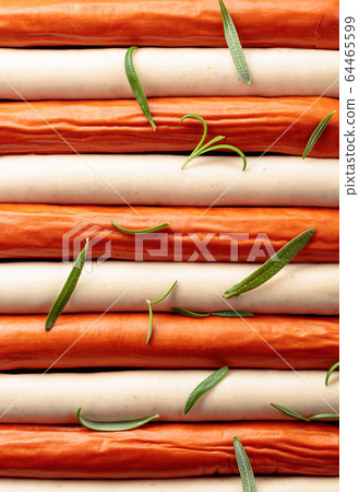 Close-up of sausages sprinkled with rosemary. 64465599