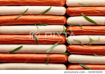 Close-up of sausages sprinkled with rosemary. Close-up of sausages sprinkled with rosemary. 64465600