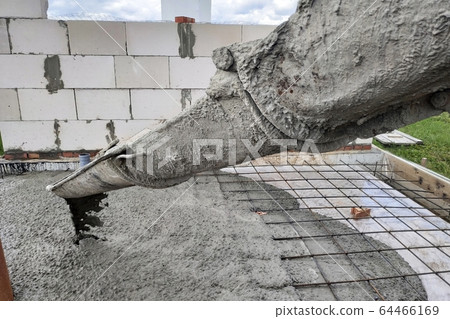 The concrete mixer feeds cement through the gutter 64466169