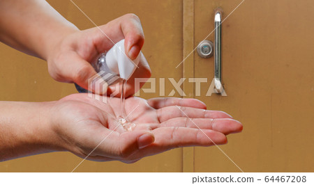 man applying alcohol gel cleaning hands after 64467208