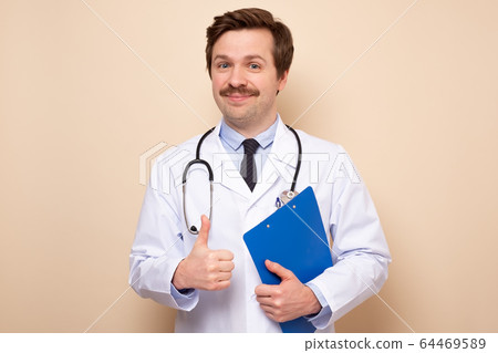 Successful doctor man giving thumbs up approving Successful doctor man giving thumbs up approving 64469589