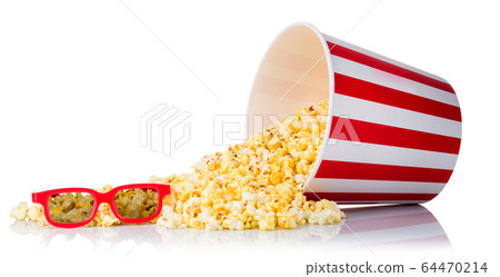 Paper striped bucket and 3D glasses on a heap of popcorn isolated on white 64470214