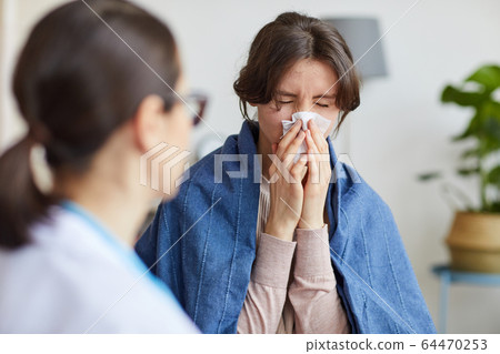 Woman visiting doctor Woman visiting doctor 64470253