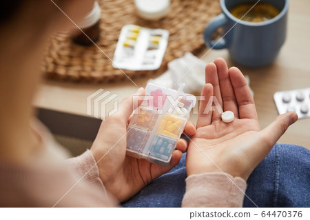 Box with pills for treatment 64470376