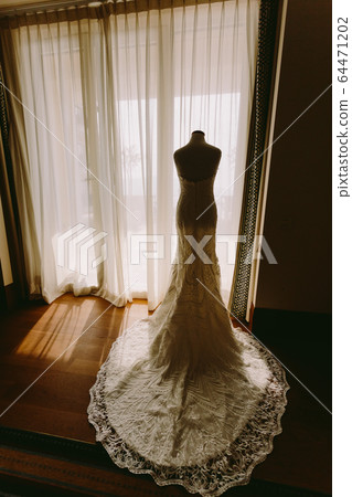 luxury wedding dress hang up indoors hotel 64471202