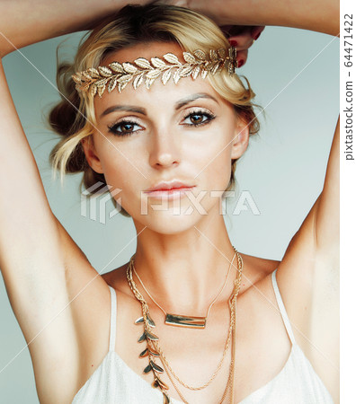 young blond woman dressed like ancient greek godess, gold jewelry and fashion makeup, people isolated on white background young blond woman dressed like ancient greek godess, gold jewelry and fashion makeup, people isolated on white background 64471422