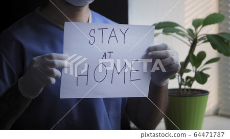 Male Medic Demonstrate Slogan To Stay At Home Male Medic Demonstrate Slogan To Stay At Home 64471787