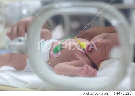 Newborn newborn incubator working hard with incubator Newborn newborn incubator working hard with incubator 64472123