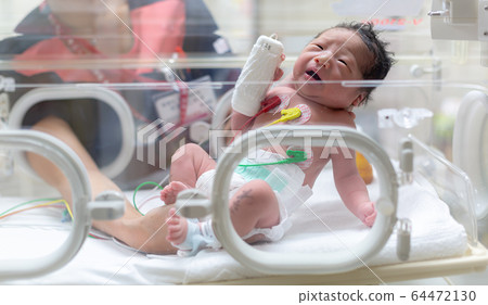 Newborn newborn incubator working hard with incubator 64472130