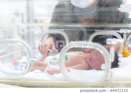 Newborn newborn incubator working hard with incubator 64472133