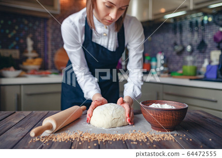 Crop woman cooking in apron Crop woman cooking in apron 64472555