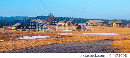 Spring sunrise in Jizerka village with rest of snow, Jizera Mountains, Czech Republic 64473098