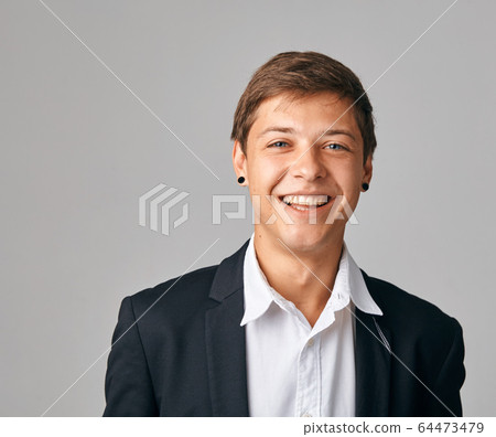 Portrait of young very happy businessman. Portrait of young very happy businessman. 64473479