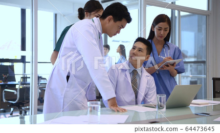 Medical concept. The doctor is dividing the duties Medical concept. The doctor is dividing the duties 64473645