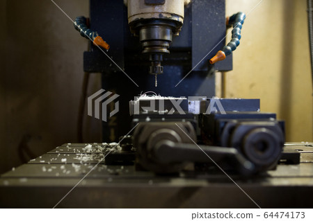 Resin tapping at machining center 64474173