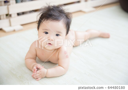A naked baby A naked baby 64480180