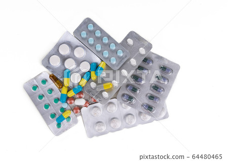 Overhead view of multiple strips of pills tablet, 64480465