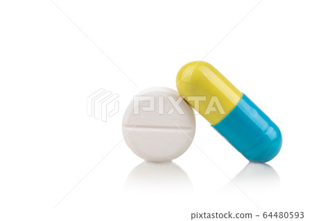 Close-up on medicine in capsule and tablet format 64480593