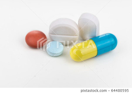 Close-up on group of medicine in capsule, caplet, 64480595