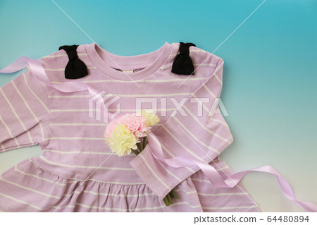 Pastel colored baby clothes 64480894