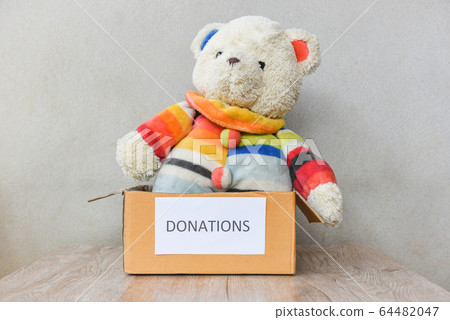 Donations box with teddy bear doll wooden table Donations box with teddy bear doll wooden table 64482047