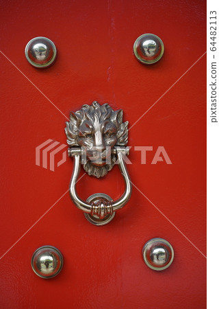 Close up of chinese door ornament with a lion head Close up of chinese door ornament with a lion head 64482113
