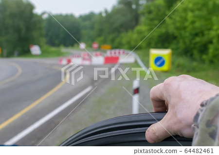 car driver hand on the background of a blocked road car driver hand on the background of a blocked road 64482461