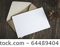 Blank white paper card with brown envelop and pine 64489404