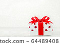 Close up of white gif box with red star pattern 64489408