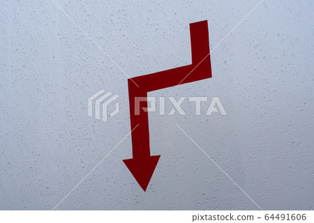 Red arrow - falling chart on glass with raindrops Red arrow - falling chart on glass with raindrops 64491606