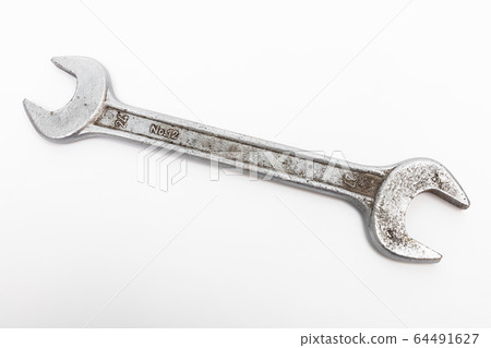 old wrench on white background 64491627