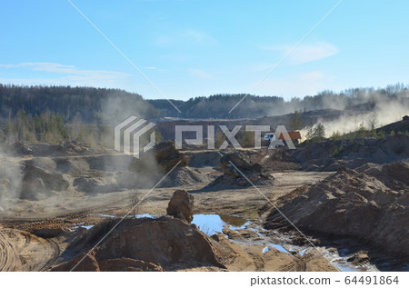 Dump truck transports sand and other minerals in quarry 64491864