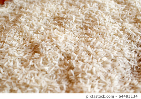 Uncooked asian white rice or Long white rice grain Uncooked asian white rice or Long white rice grain 64493134
