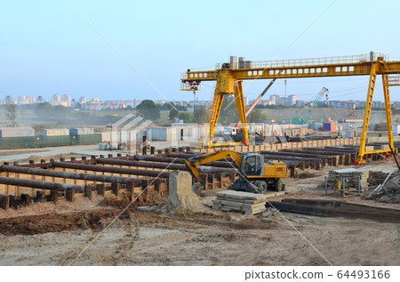 Excavator working at construction of a new metro line 64493166