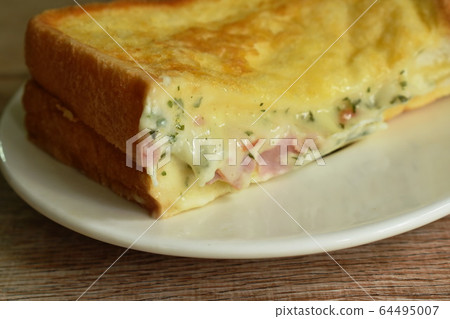 French toast sandwich stuffed bacon and cheese on plate  64495007