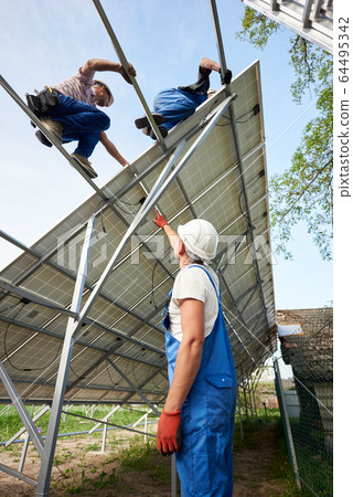 Stand-alone exterior solar panel system installation, renewable green energy generation concept. 64495342