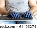 Hands in medical gloves on the keyboard. Communication, people and freelance work concept 64496274