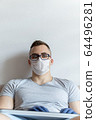 The quarantined guy works remotely from home. Communication, people and freelance work concept 64496281