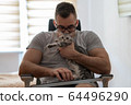 The quarantined guy is lying in bed. Communication, people and freelance work concept 64496290