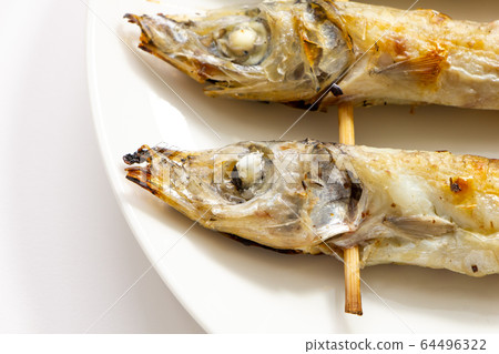 Up of grilled nippers. (White plate, white background) Up of grilled nippers. (White plate, white background) 64496322