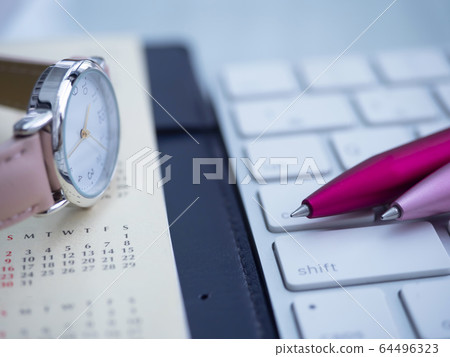 Business image · calendar · keyboard · notebook · woman 64496323
